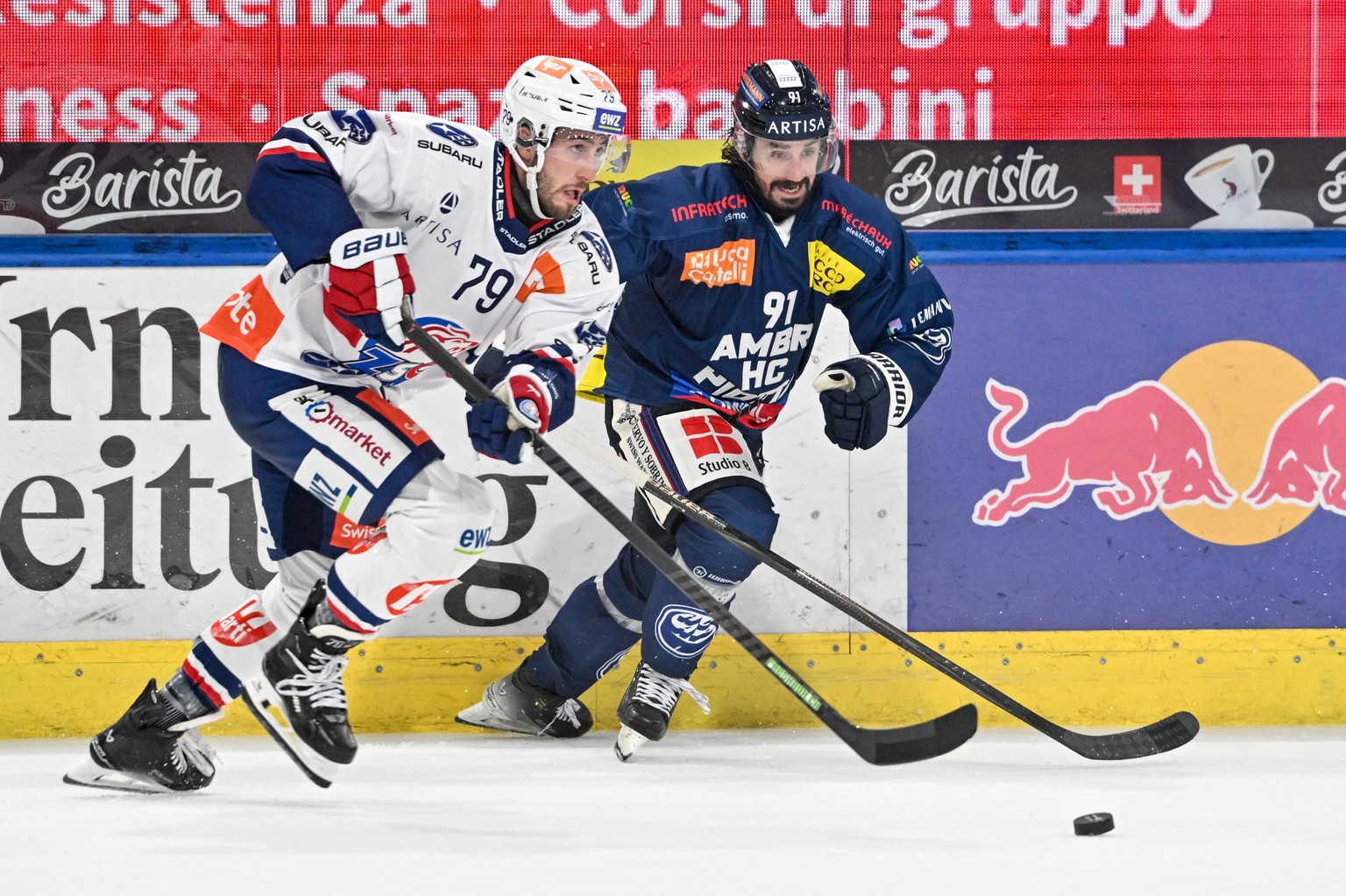 Thierry Bader (ZSC) protects the puck from Nicolas Petan (HCAP), during the regular season of National League A (NLA) Swiss Championship 2025/26 between HC Ambri Piotta and ZSC Lions at the ice stadiu ...