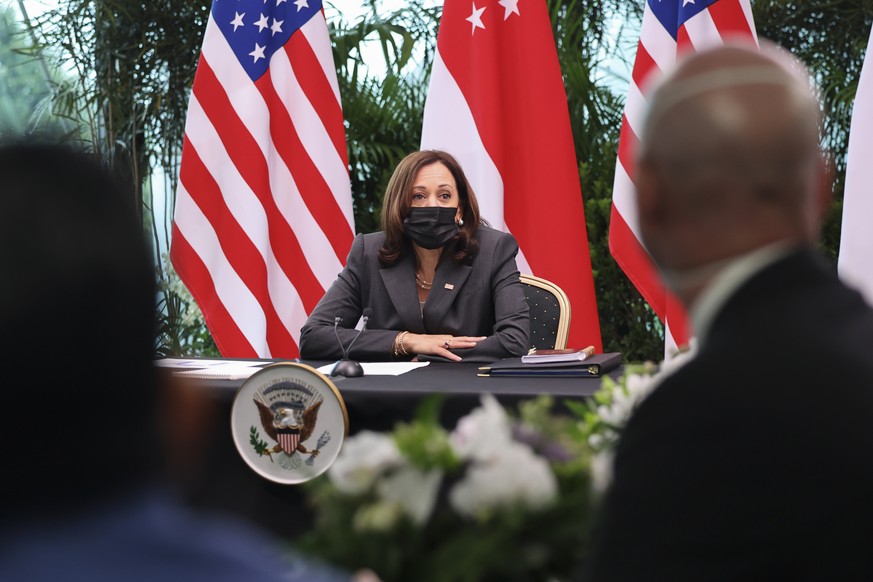 U.S. Vice President Kamala Harris, center, attends a roundtable at Gardens by the Bay in Singapore before departing for Vietnam on the second leg of her Southeast Asia trip, Tuesday, Aug. 24, 2021. (E ...