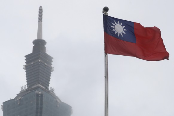 FILE - A Taiwanese national flag flies near the Taipei 101 building on National Dr.  Sun Yat-Sen Memorial Hall in Taipei, Taiwan, on May 7, 2023. Taiwan said Wednesday, November 1, 2023 that China...