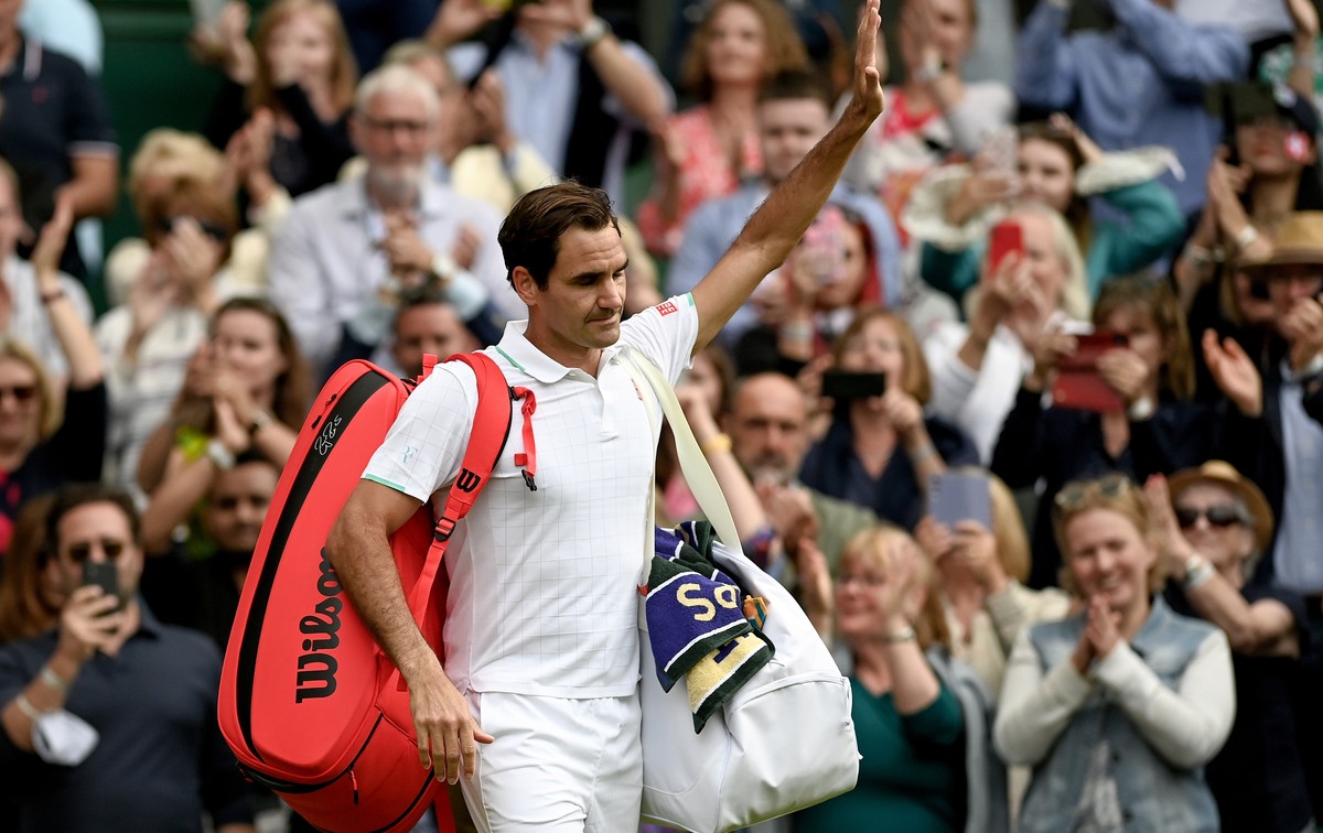 epa09329381 Roger Federer of Switzerland reacts as he leaves the court after the men's quarter final match against Hubert Hurkacz of Poland at the Wimbledon Championships, in Wimbledon, Britain,  ...