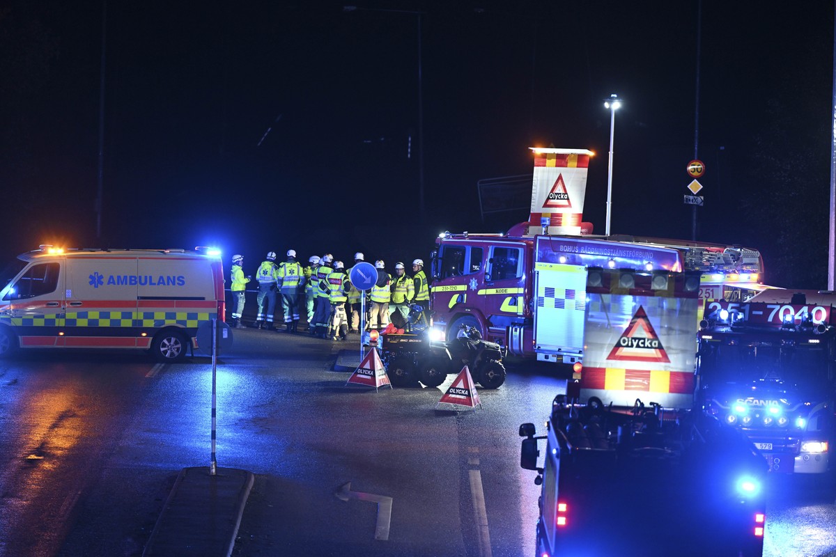A view of emergency services on the E6 near Stenungsund, closed in both directions after persistent rain caused a landslide, in Stenungsund, Saturday, Sept. 23, 2023. Three people have been injured an ...