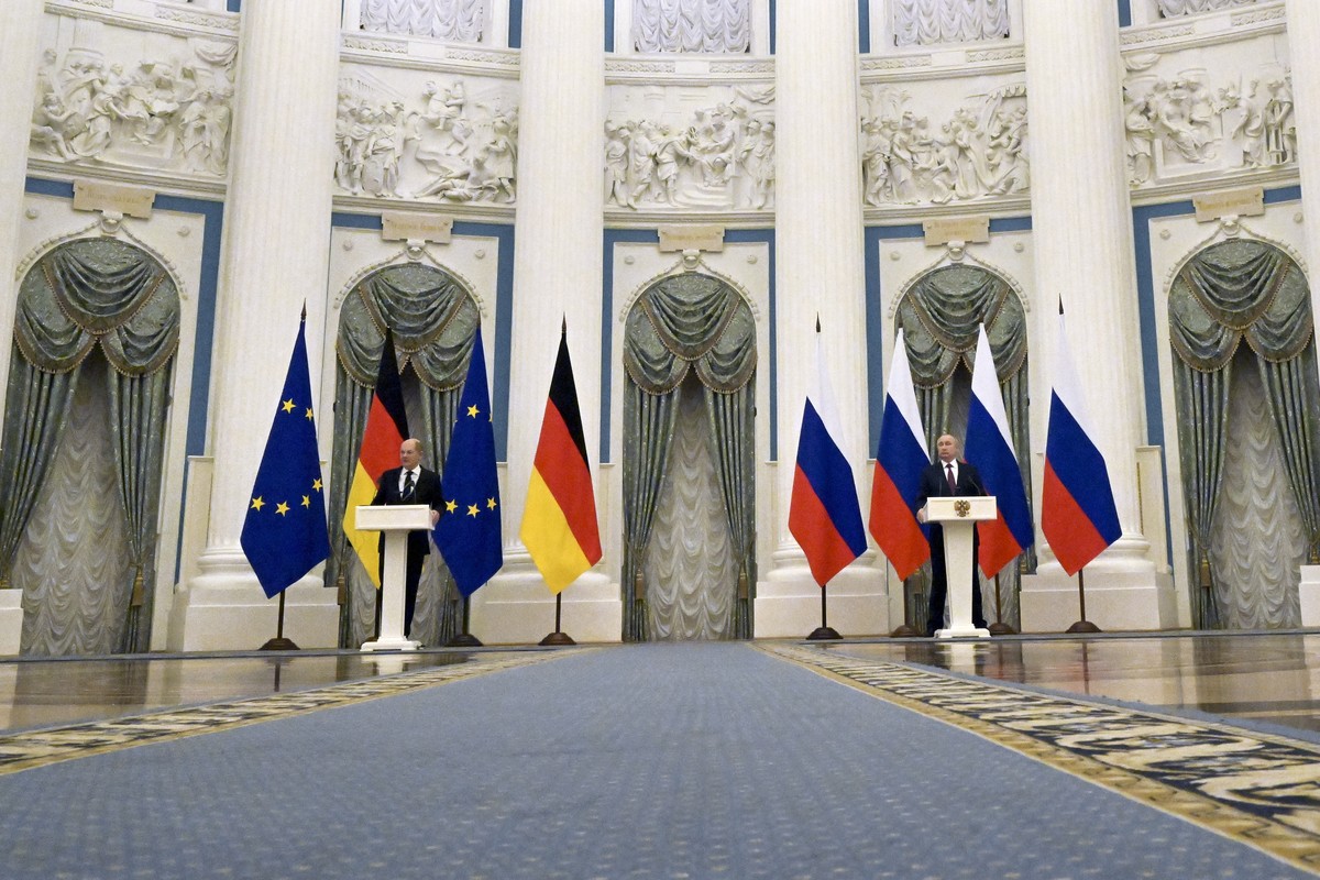 Russian President Vladimir Putin, right, and German Chancellor Olaf Scholz attend a joint news conference following their talks in the Kremlin in Moscow, Russia, Tuesday, Feb. 15, 2022. Putin says Mos ...