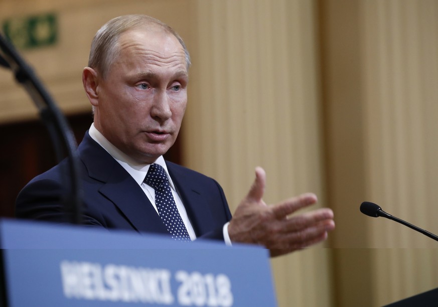 Russian President Vladimir Putin speaks during a press conference after the meeting of U.S. President Donald Trump and Russian President Vladimir Putin at the Presidential Palace in Helsinki, Finland, ...