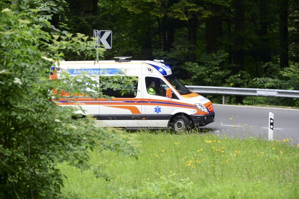 epa04804985 An ambulance on the way to the scene of an accident near, Engelberg, Switzerland, 17 June 2015. The accident occurred on a road between Engelberg and Wolfenschiessen in the canton of Obwal ...