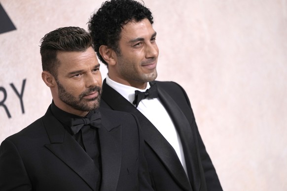 Ricky Martin, left, and Jwan Yosef pose for photographers upon arrival at the amfAR Cinema Against AIDS benefit at the Hotel du Cap-Eden-Roc, during the 75th Cannes international film festival, Cap d& ...