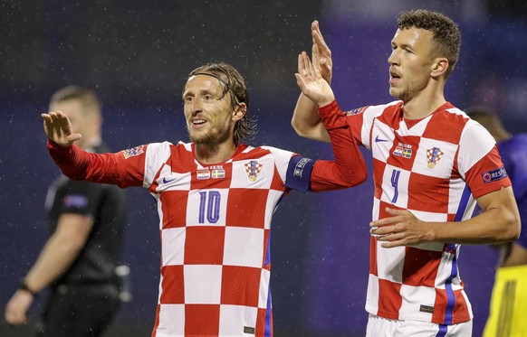 epa08736128 Croatia's Luka Modric (L) and Croatia's Ivan Perisic (R) celebrate the team's 1-0 goal during the UEFA Nations League group A3 soccer match between Croatia and Sweden in Spl ...