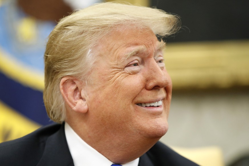 President Donald Trump smiles as he meets with American pastor Andrew Brunson in the Oval Office of the White House, Saturday Oct. 13, 2018, in Washington. Trump welcomed Brunson to the Oval Office on ...