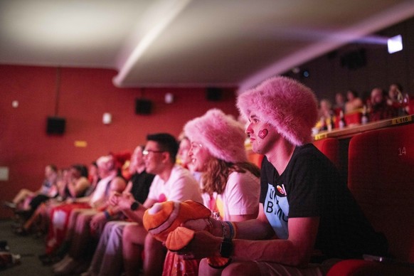 People wearing hats like Nemo listen to the song The Codes by Nemo during the broadcast of the final of the 68th Eurovision Song Contest on Saturday, 11 May 2024, at the public viewing in the Orion ci ...
