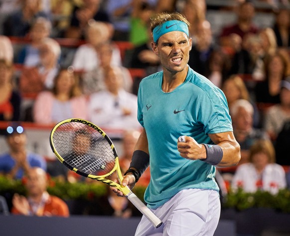 epa07765179 Rafael Nadal of Spain gestures while in action against Fabio Fognini of Italy during their quater-final match at the Rogers Cup tennis tournament in Montreal, Canada, 09 August 2019. EPA/V ...