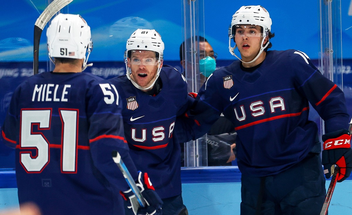 epa09744278 Brian O'Neill (C) of the USA celebrates with teammates after scoring a goal during the Men's Ice Hockey preliminary round match between the USA and China at the Beijing 2022 Olym ...