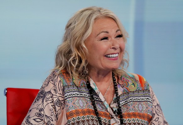 Roseanne Barr talks with Fox News talk show host Sean Hannity while being interviewed during a taping of his show, Thursday, July 26, 2018, in New York. The comedian and actress will appear on the Fox ...