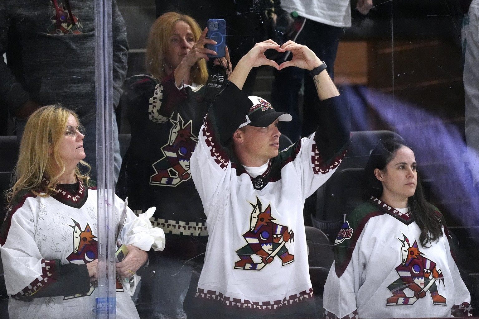 Arizona Coyotes fans watch players acknowledge the crowd after the Coyotes&#039; NHL hockey game against the Edmonton Oilers on Wednesday, April 17, 2024, in Tempe, Ariz. The Coyotes won 5-2. Team own ...