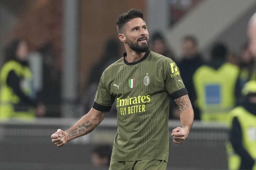 AC Milan&#039;s Olivier Giroud celebrates after scoring his side&#039;s opening goal during the Italian Serie A soccer match between AC Milan and Torino at the San Siro stadium in Milan, Italy, Saturd ...