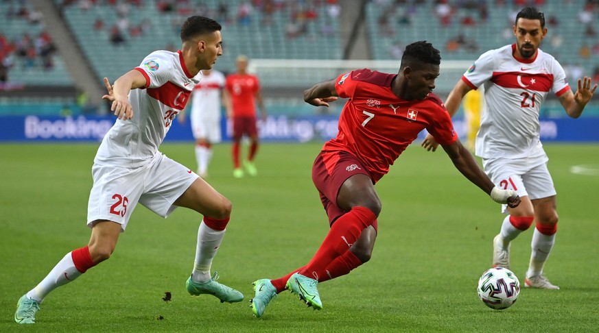 epa09288674 Breel Embolo (C) of Switzerland in action during the UEFA EURO 2020 group A preliminary round soccer match between Switzerland and Turkey in Baku, Azerbaijan, 20 June 2021. EPA/Dan Mullan  ...