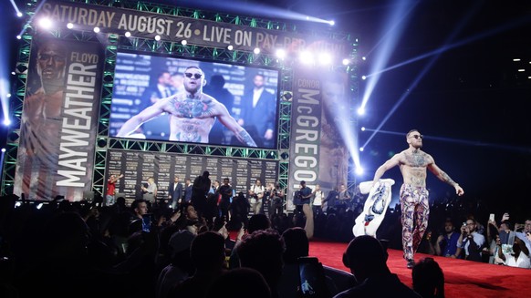 Conor McGregor arrives for a news conference at Barclays Center on Thursday, July 13, 2017, in New York. McGregor is scheduled to fight Floyd Mayweather Jr. in a junior middleweight boxing bout next m ...