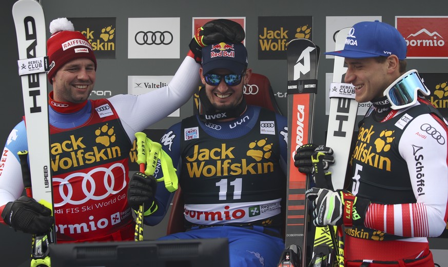 From left, Switzerland&#039;s Beat Feuz, Italy&#039;s Dominik Paris, and Austria&#039;s Matthias Mayer share a laugh at the finish area of an alpine ski, men&#039;s World Cup downhill, in Bormio, Ital ...