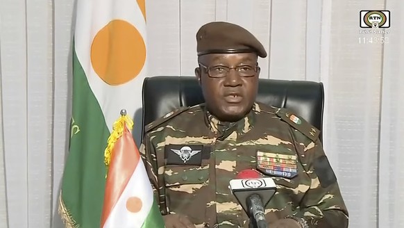 In this image taken from video provided by ORTN, Gen. Abdourahmane Tchiani makes a statement Friday, July 28, 2023, in Niamey, Niger. Niger state television identified him as the leader of the Nationa ...