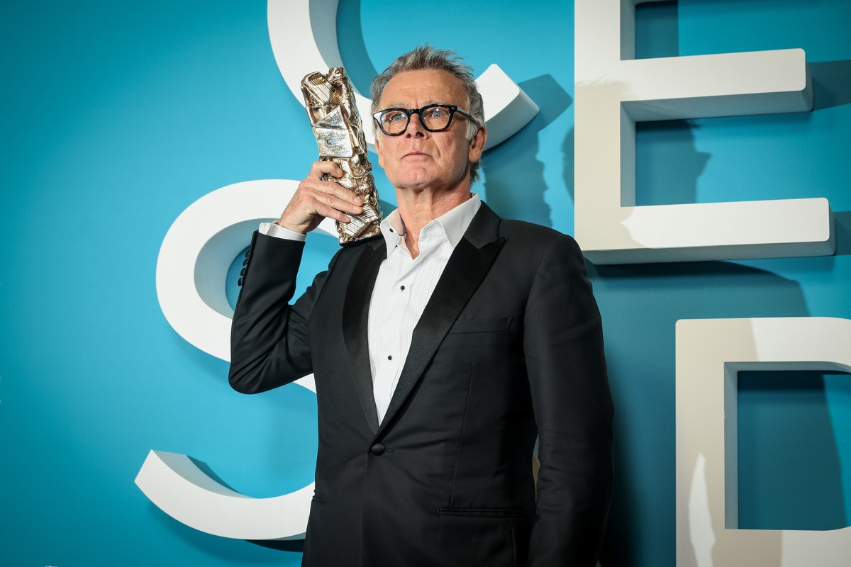 French actor Franck Dubosc poses after receiving the Cesar for the Best Original Screenplay award for the movie "Un Ours dans le Jura," during the 51st Cesar Awards ceremony, in Paris, Thurs ...
