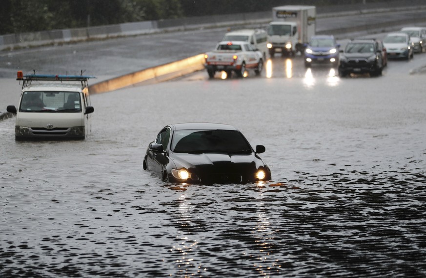 Vehicles are stranded by flood water in Auckland, Saturday, Jan 28, 2023. Record levels of rainfall pounded New Zealand&#039;s largest city, causing widespread disruption. (Dean Purcell/New Zealand He ...