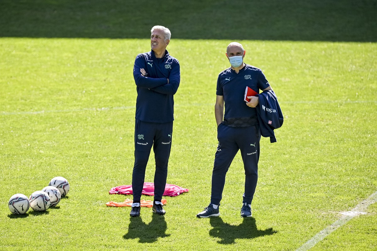 epa09106360 Switzerland's head coach Vladimir Petkovic (L) and Switzerland's Director of Professional Football, Pierluigi Tami, during a training session at the Kybunpark stadium in St. Gall ...