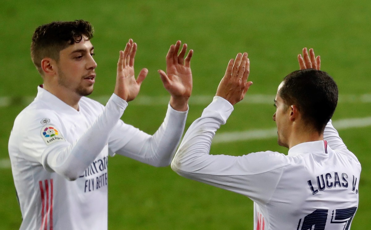 epa08896956 Real Madrid's striker Lucas Vazquez (R) celebrates with teammate Federico Valverde (L) after scoring the 1-3 goal during the Spanish LaLiga soccer march between SD Eibar and Real Madr ...