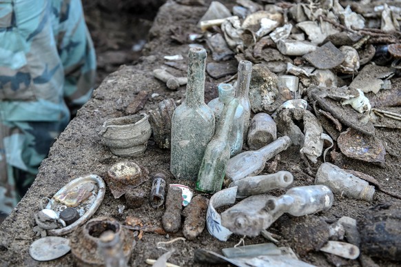 epa06376663 The view of items found during the archeological works on the site of the former Nazi German Death Camp in Sobibor, east Poland, 08 December 2017. This archeological excavations are part o ...