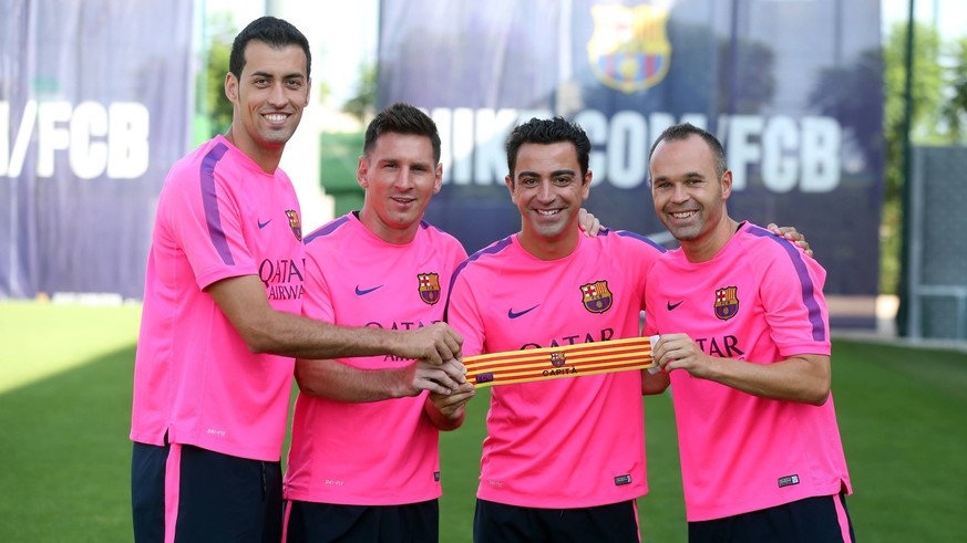 BARCELONA, SPAIN, AUGUST 07: Sergio Busquets, Lionel Messi, Xavi and Andres Iniesta, new captains of FC Barcelona for the season 2014 - 2015. (Photo: FC Barcelona / Cordon Press) PUBLICATIONxINxGERxSU ...