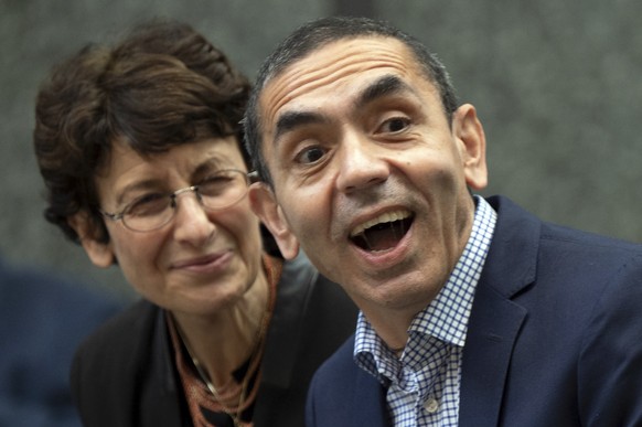 Ugur Sahin, right, and Ozlem Tureci sit in the front row in Cologne, Germany,, Sept. 17, 20212. Cologne honors the Biontech founders in the city hall. The two researchers sign the city&#039;s Golden B ...