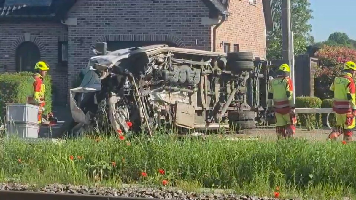 This video grab shows rescue workers on the scene of a crash between a train and vehicle in Buggenhout, Belgium, Tuesday, May 26, 2026. (VTM via AP)
Belgium Crash