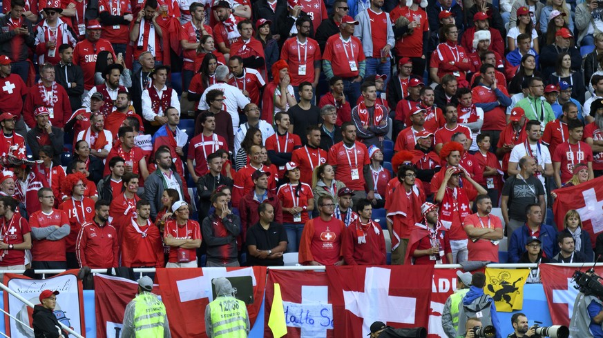 Switzerland&#039;s fans are pictured behind an advertising of China Mengniu Dairy Company during the FIFA World Cup 2018 group E preliminary round soccer match between Switzerland and Serbia at the Ar ...