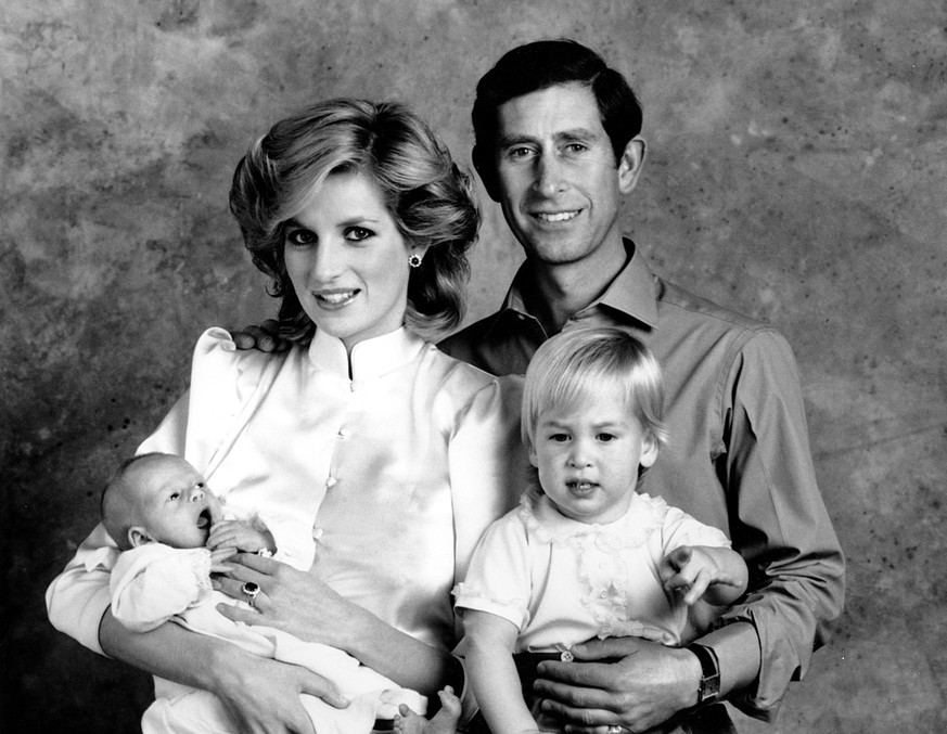 The Prince and Princess of Wales, Prince Charles and Princess Diana, pose for a family portrait with their sons, Prince William, right, and Prince Harry, at the Kensington Palace in London, England on ...