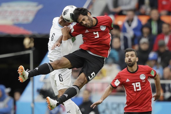 Uruguay&#039;s Rodrigo Bentancur, background, and Egypt&#039;s Marwan Mohsen challenge for the ball during the group A match between Egypt and Uruguay at the 2018 soccer World Cup in the Yekaterinburg ...