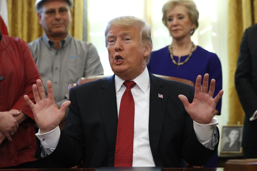 President Donald Trump speaks during a meeting with American manufacturers in the Oval Office of the White House, Thursday, Jan. 31, 2019, in Washington. Trump was signing an executive order pushing t ...