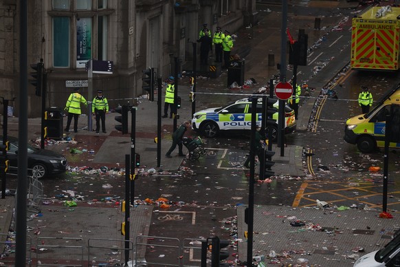 KEYPIX - epa12137530 The scene where a car collided with Liverpool supporters during the trophy parade in Liverpool city centre, Britain, 26 May 2025. A man has been detained after the collision with  ...