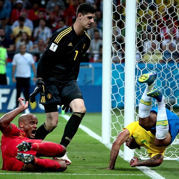 epa06869580 Vincent Kompany of Belgium (L), goalkeeper Thibaut Courtois of Belgium (C) and Gabriel Jesus of Brazil in action during the FIFA World Cup 2018 quarter final soccer match between Brazil an ...