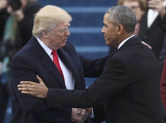 U.S. President-elect Donald Trump greets outgoing President Barack Obama (R) before Trump is inaugurated during ceremonies on the Capitol in Washington, U.S., January 20, 2017. REUTERS/Carlos Barria