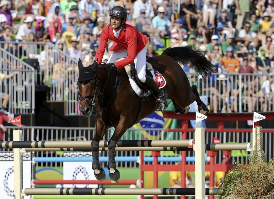 2016 Rio Olympics - Equestrian - Final - Jumping Individual Final Round A + B - Olympic Equestrian Centre - Rio de Janeiro, Brazil - 19/08/2016. Steve Guerdat (SUI) of Switzerland riding Nino Des Buis ...