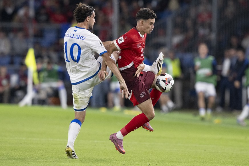 Switzerland&#039;s Fabian Rieder, right, against Kosovo&#039;s Leon Avdullahu, during the FIFA 2026 World Cup Group B qualifying soccer match between Switzerland and Kosovo at the St. Jakob-Park stadi ...