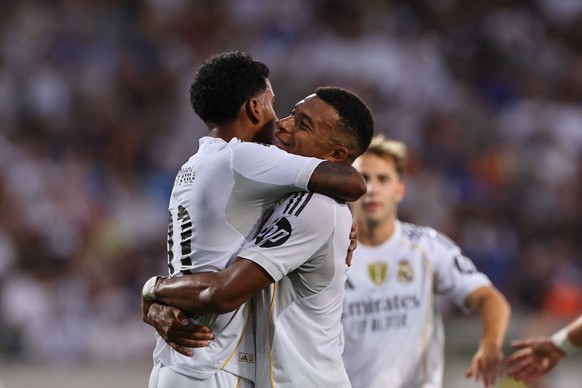 epa12296068 Rodrygo of Real Madrid (L) celebrates with Kylian Mbappe (R) after scoring the 0-4 goal during a friendly match between WSG Tirol and Real Madrid, in Innsbruck, Austria, 12 August 2025. EP ...