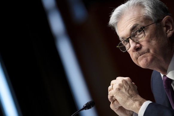 Federal Reserve Board Chairman Jerome Powell listens during his re-nominations hearing before the Senate Banking, Housing and Urban Affairs Committee, Tuesday, Jan. 11, 2022, on Capitol Hill in Washin ...