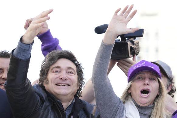 Argentine President Javier Milei and his sister, Secretary General of the Presidency, Karina Milei wave during a rally ahead of legislative provincial elections in Lomas de Zamora, Argentina, Wednesda ...