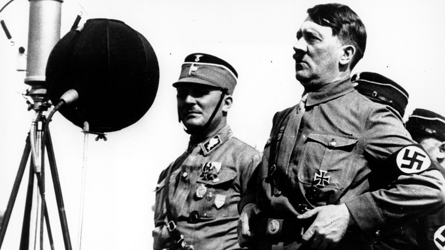German chancellor Adolf Hitler speaks to 30,000 uniformed Nazi storm troopers at Kiel, Germany on May 7, 1933. He condemned the &quot;1918 traitors&quot; of World War I, accusing them of losing the wa ...