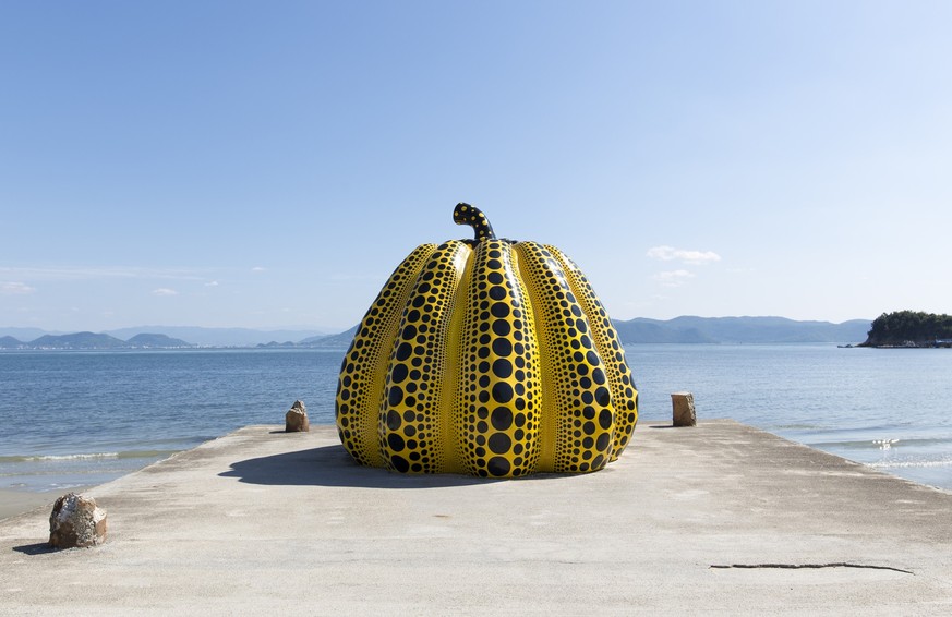 NAOSHIMA, JAPAN. JUNE 6: Yayoi Kusamas giant pumpkin sculpture, NAOSHIMA, JAPAN. JUNE 6: Yayoi Kusamas giant pumpkin sculpture in Naoshima. June 6, 2016 on Naoshima Art island, Japan.
