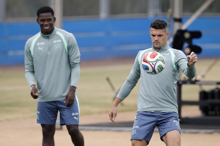 Switzerland's Granit Xhaka, right, and Breel Embolo warm up during a training session of the Swiss national soccer team at the SDJA in San Diego, California, USA, Saturday, June 27, 2026, during  ...