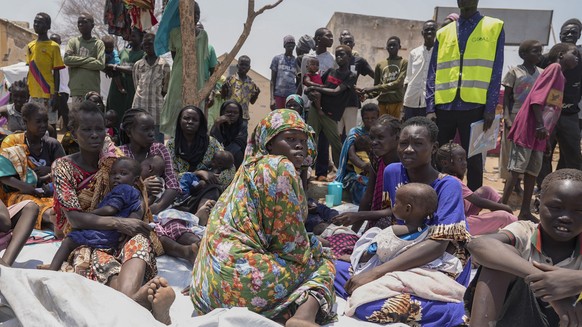 FILE - South Sudanese who fled from Sudan sit outside a nutrition clinic at a transit center in Renk, South Sudan, May 16, 2023. The U.N. migration agency says Sudan?s conflict has displaced more than ...