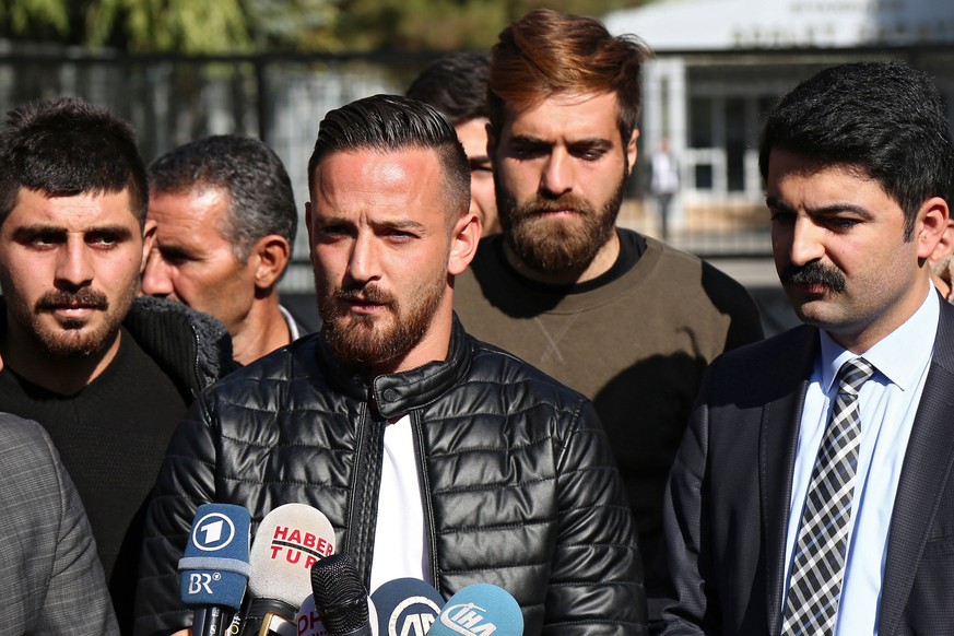 epa06424923 (FILE) - German-Kurdish soccer player Deniz Naki (C) speaks to the press after the case against him was dropped, in Diyarbakir, Turkey, 08 November 2016 (reissued 08 January 2017). Accordi ...