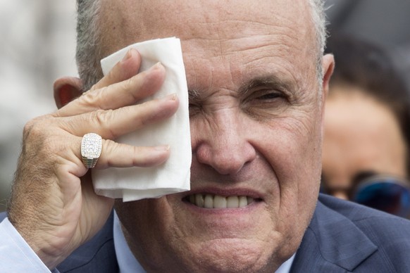 epa07872765 (FILE) - Attorney to US President Donald J. Trump Rudy Giuliani wipes his brow before the start of the White House Sports and Fitness Day at the South Lawn of the White House in Washington ...