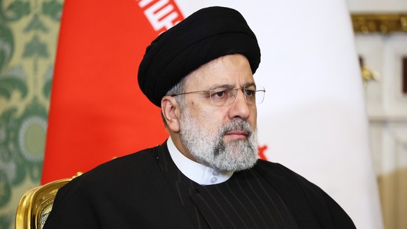 epa11015891 Iranian President Ebrahim Raisi listens to Russian President Vladimir Putin (unseen) during their meeting at the Kremlin in Moscow, Russia, 07 December 2023. EPA/PAVEL BEDNYAKOV / KREMLIN  ...