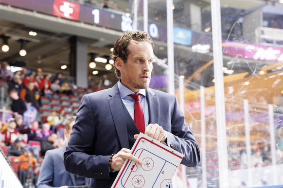 Patrick Fischer, head coach of Switzerland national ice hockey team, arrives for the second period, during the IIHF 2023 World Championship preliminary round group B game between Switzerland and Kazak ...