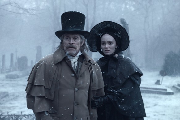 This image released by Focus Features shows Willem Dafoe, left, and Lily-Rose Depp in a scene from &quot;Nosferatu.&quot; (Focus Features via AP)